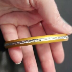 Gold tone and silver tone bangle bracelet